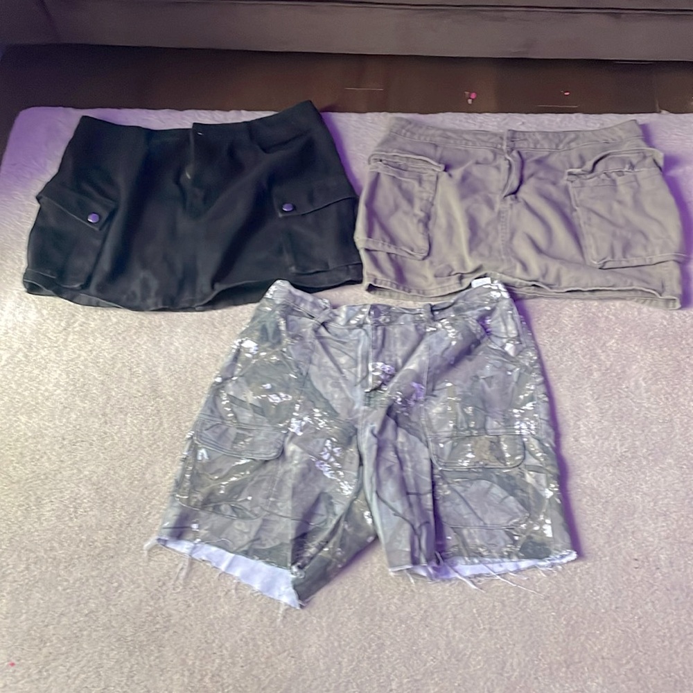 3 Pc SHEIN Curve 1XL set. One short (camo) and two skirts (black and green).